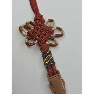 Handcrafted paracord lanyard with a decorative knot and quick-release buckle